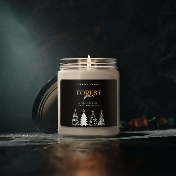 Winter candles in a stylish jar with a forest design, perfect for cozying up the winter season.