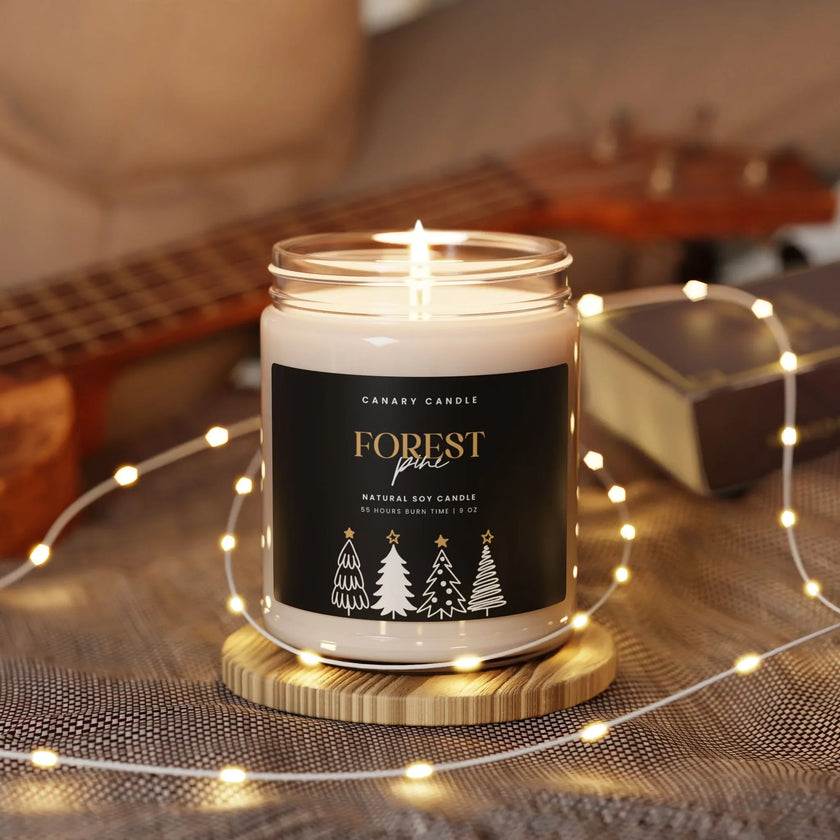 Holiday candle - Forest Pine Scented Soy 9oz Jar with a warm glow and elegant design in a cozy setting.
