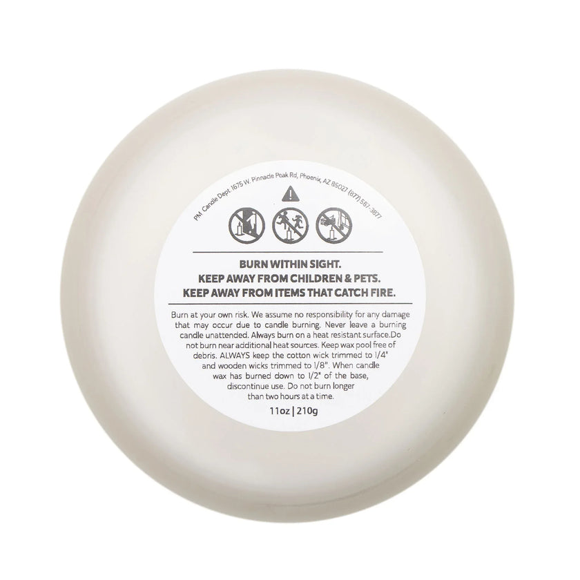 Bottom view of a Retirement Gift Candle showing safety instructions and burn guidelines.