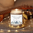 Thank You gift - Personalized Holiday Village Soy Candle on a wooden stand with warm lights in a cozy setting.