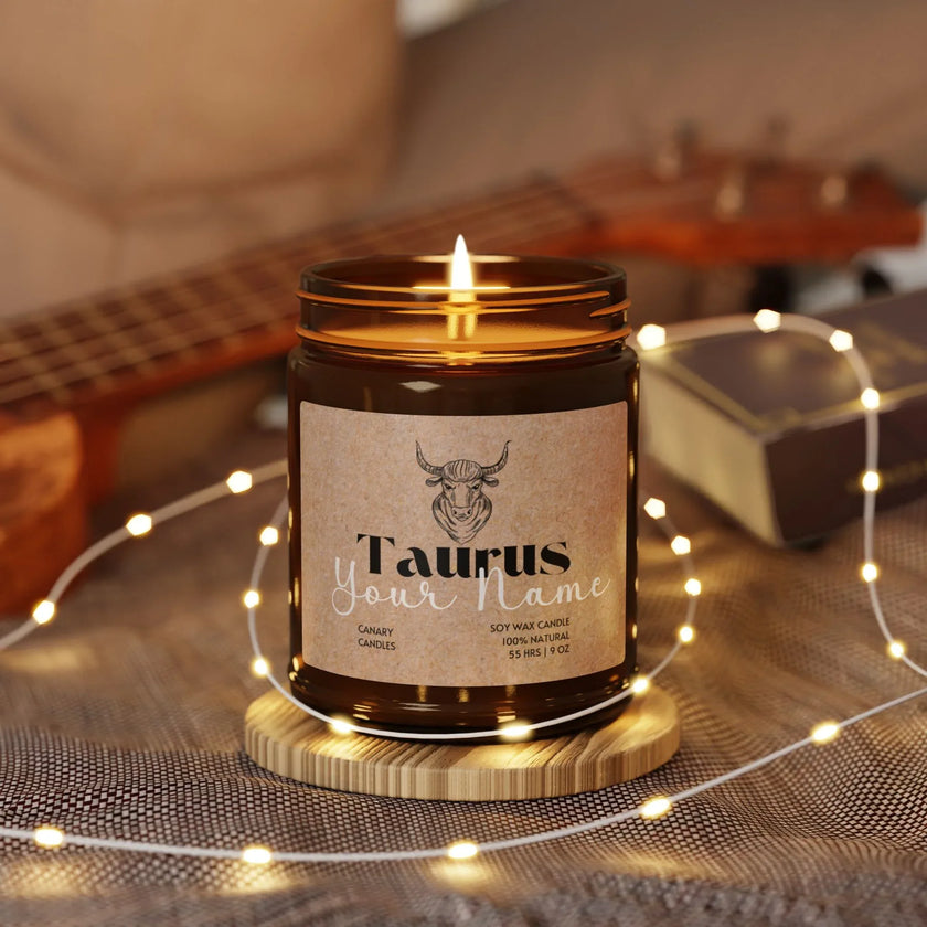 Personalized Taurus candle in amber jar, warm glow with string lights, perfect zodiac gift.