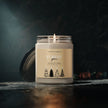 Forest Pine Soy Candle in a glass jar with a black lid, emitting a warm glow for relaxation and holiday gifting.