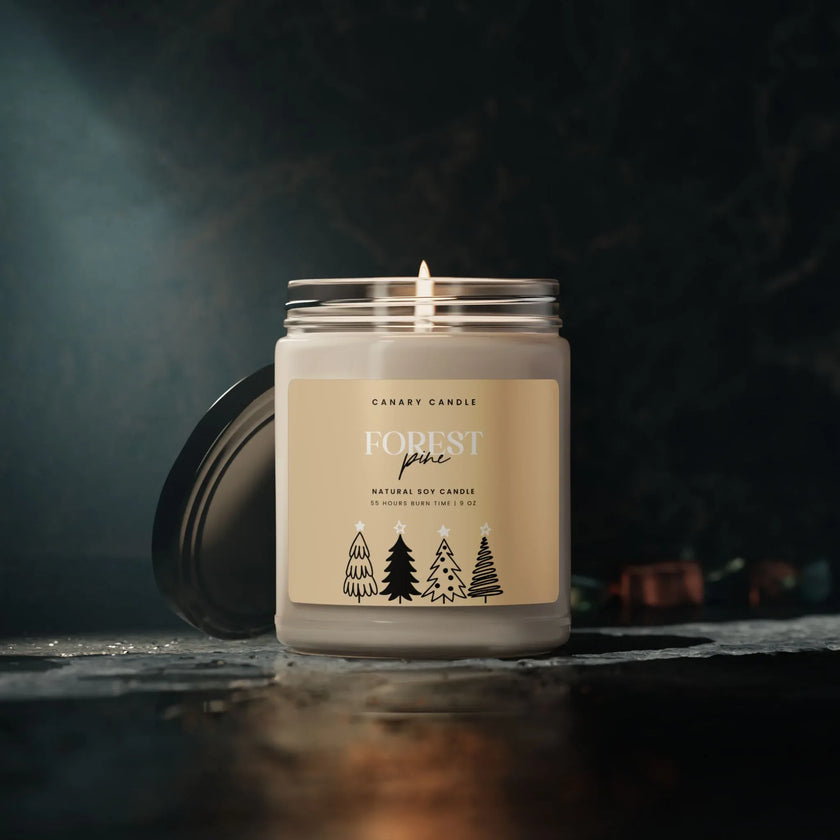 Forest Pine Soy Candle in a glass jar with a black lid, emitting a warm glow for relaxation and holiday gifting.