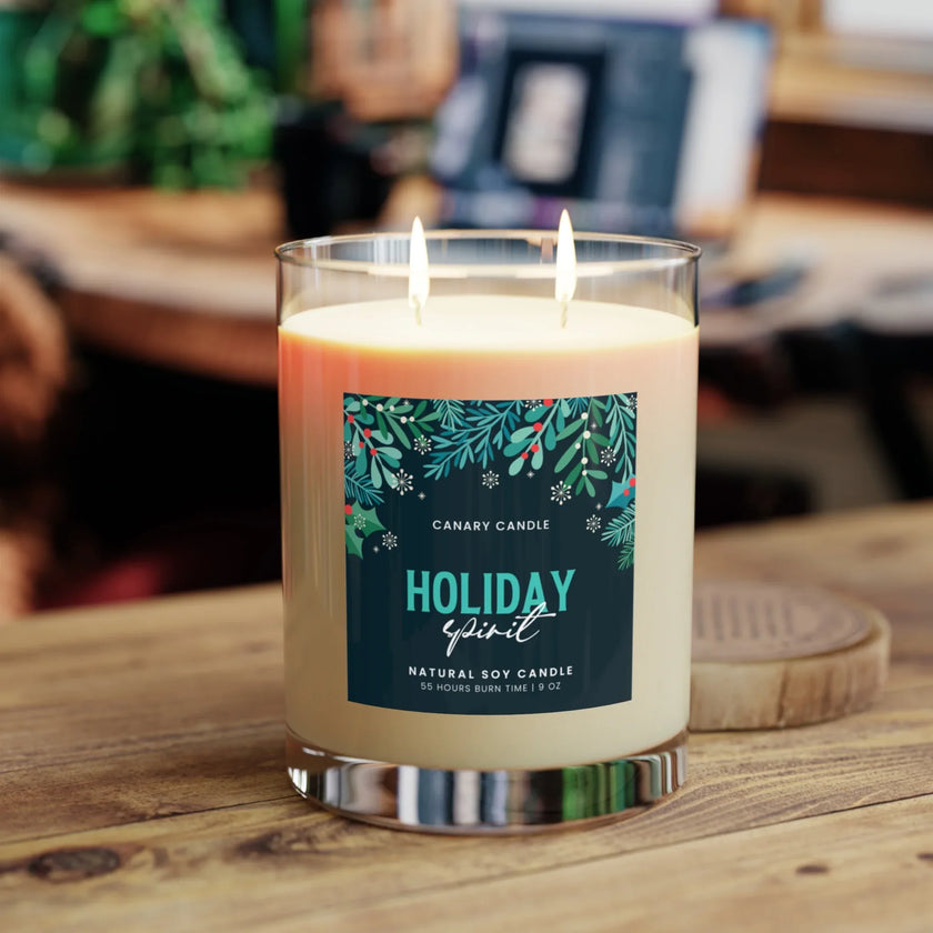 Holiday Spirit Scented Candle 11oz with dual wicks, in a cozy room setting, emitting a warm glow.