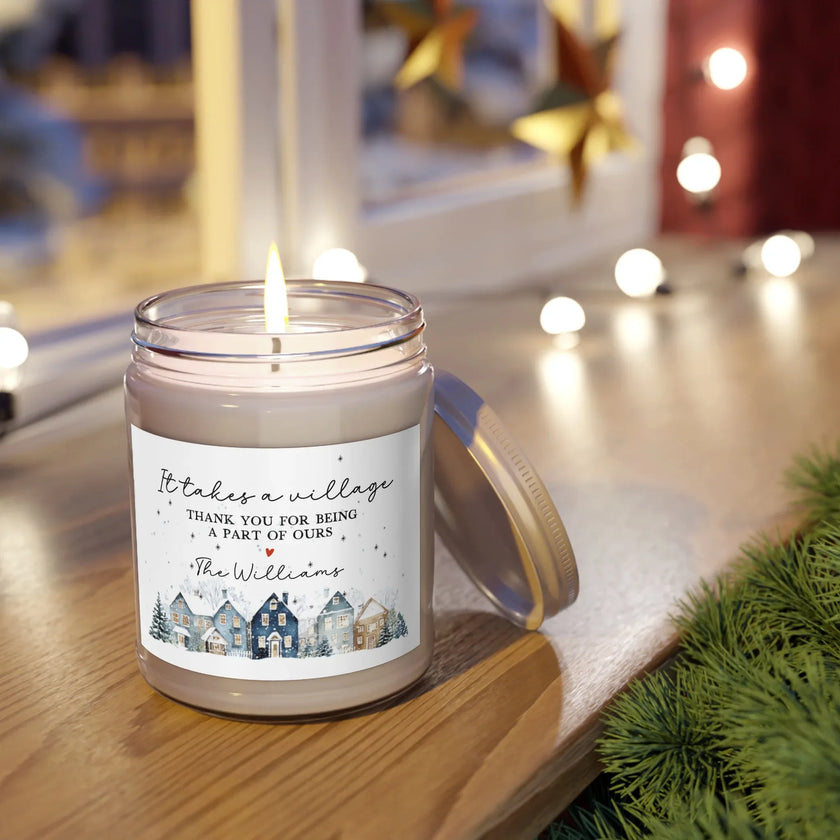 Thank You gift - Personalized Holiday Village Soy Candle with burning wick and village-themed label on a cozy table.