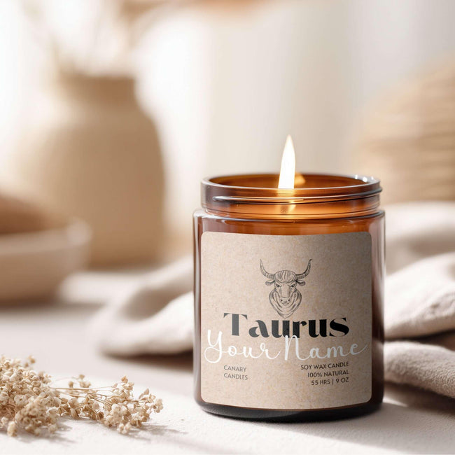 Personalized Taurus candle in amber jar, 100% natural soy wax, with a gentle flame creating a warm ambiance.