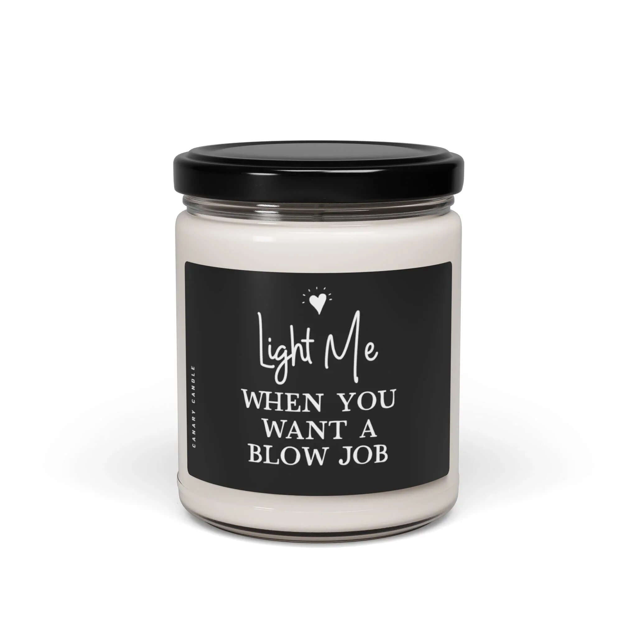 Naughty Soy Candle in a clear jar with a playful label saying 'Light Me When You Want A BJ'