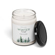 Winter Candle in a reusable glass jar with a black lid, featuring a forest-inspired design.