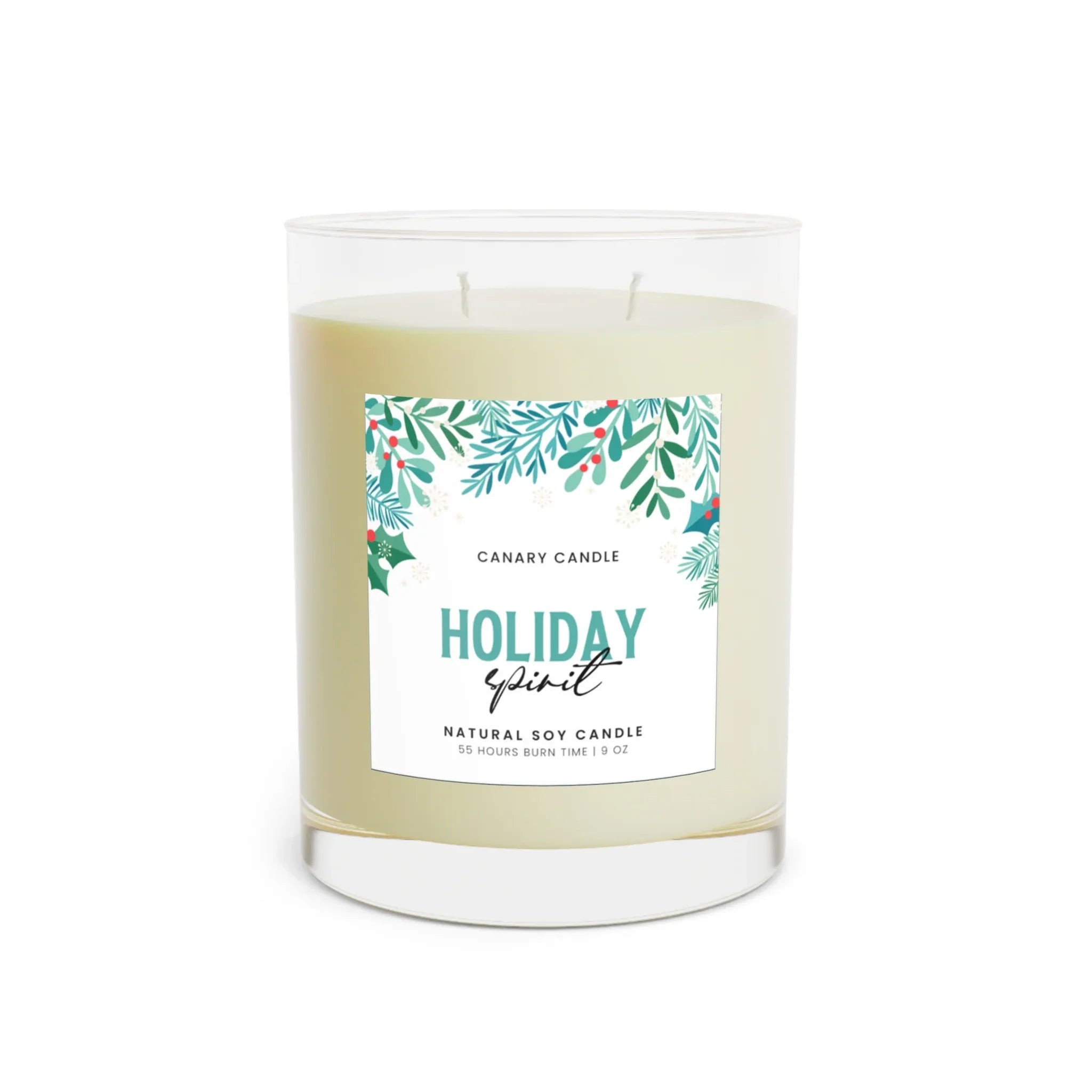 Holiday Spirit Scented Candle in a clear glass jar with a festive label featuring greenery.