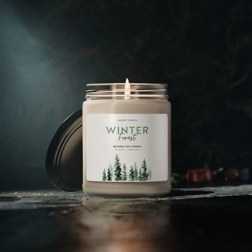 Winter Candle - Forest Scented Soy in a reusable glass jar with a glossy label and burning wick.