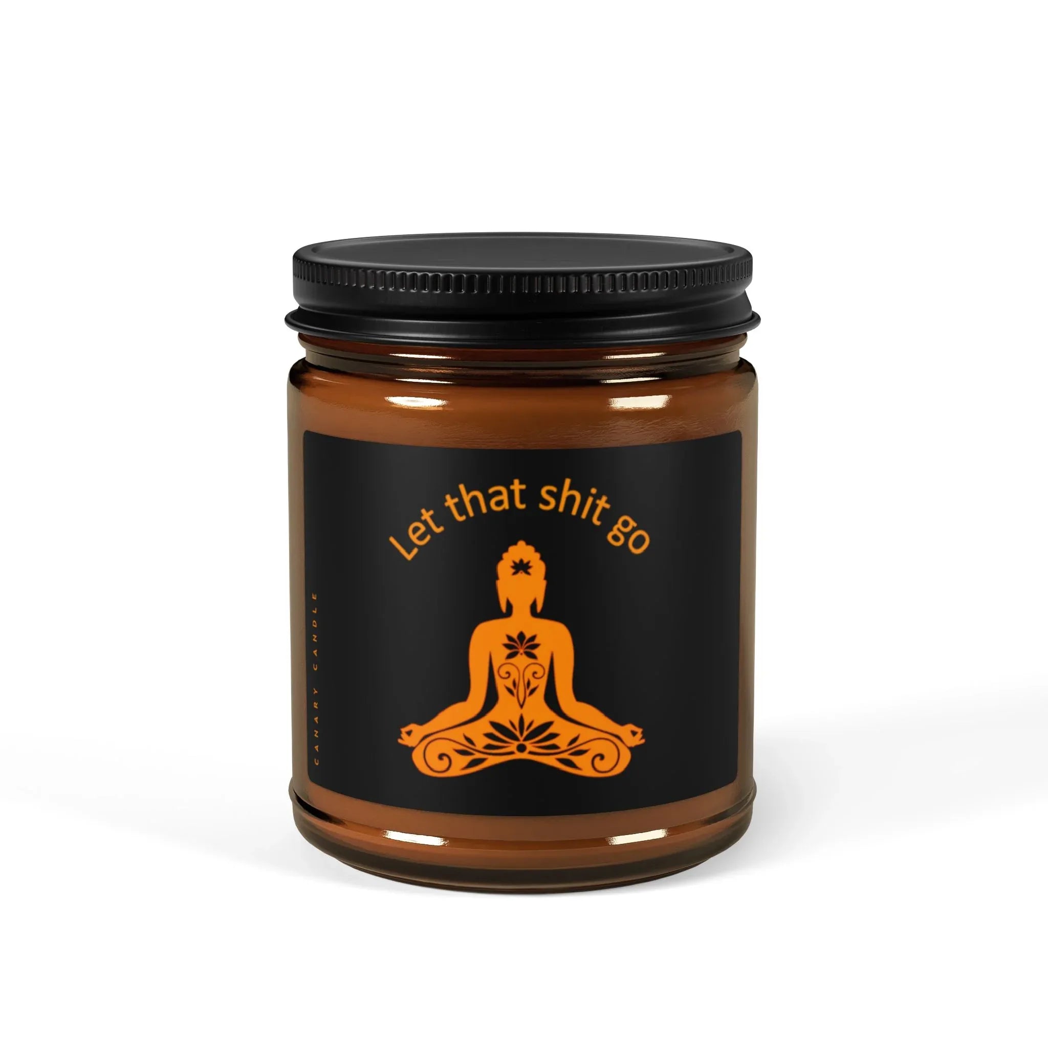 Funny soy candle in warm amber jar with cheeky 'Let that shit go' label for aromatherapy and mood enhancement.