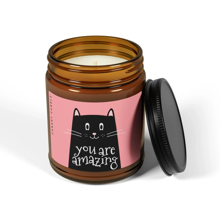 Amazing Soy Candle in amber jar with playful cat design and hand-poured soy wax.