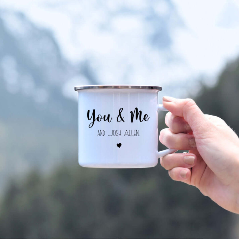 You & Me and Josh Allen camping mug in a hand with mountains in the background, perfect Buffalo Bills gift.