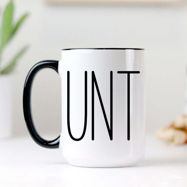 Sarcastic Coffee Mug with the word 'UNT' printed in bold, high-quality ceramic with a black handle and two-tone design.
